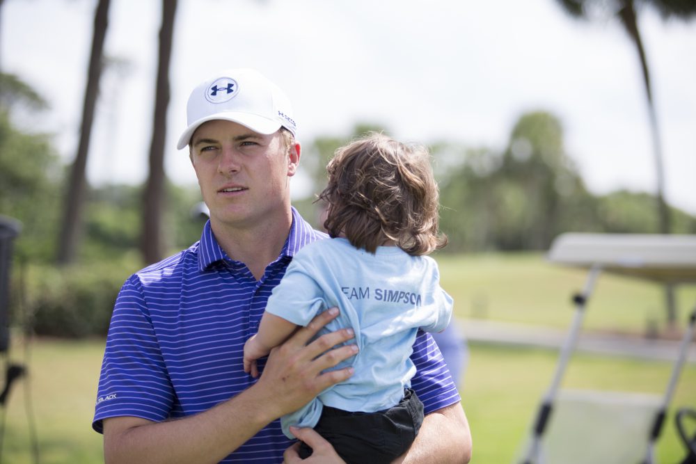 Jordan Spieth lends a hand to a caddie with a heartfelt mission